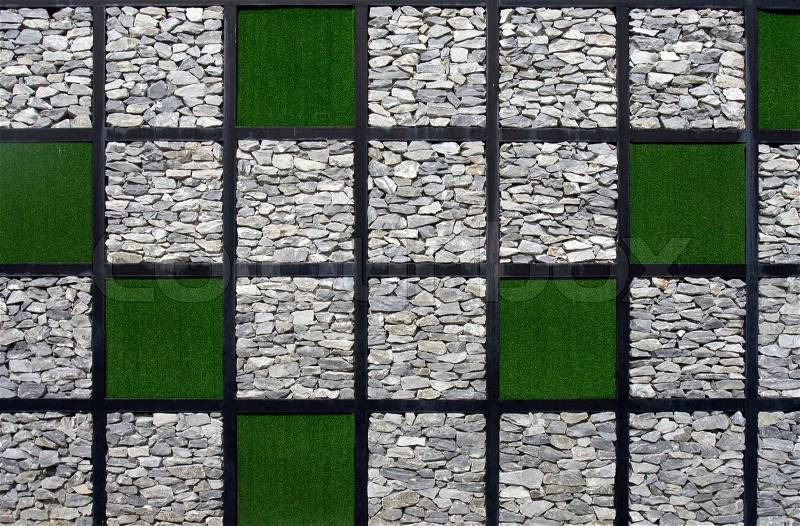 Artificial grass and stone pattern wall, stock photo