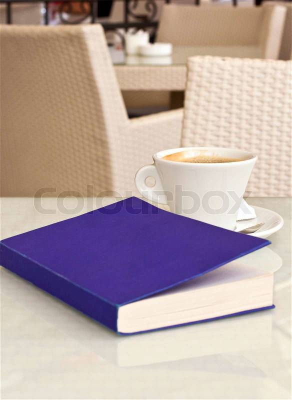 Cup of coffee and book, stock photo
