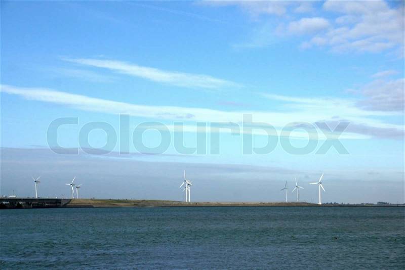Dam, sea and wind green energy in Zeeland, stock photo