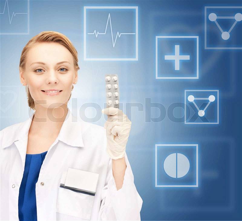 Attractive female doctor with pills, stock photo