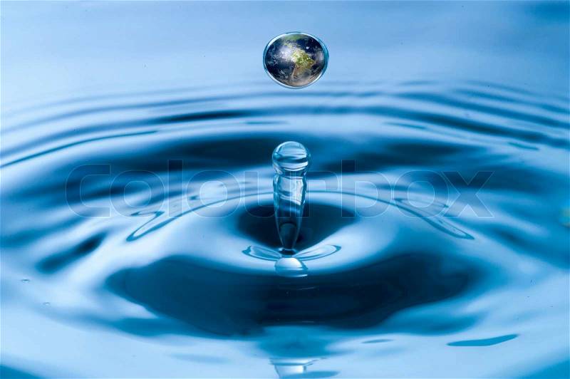 Globe inside water droplet, stock photo