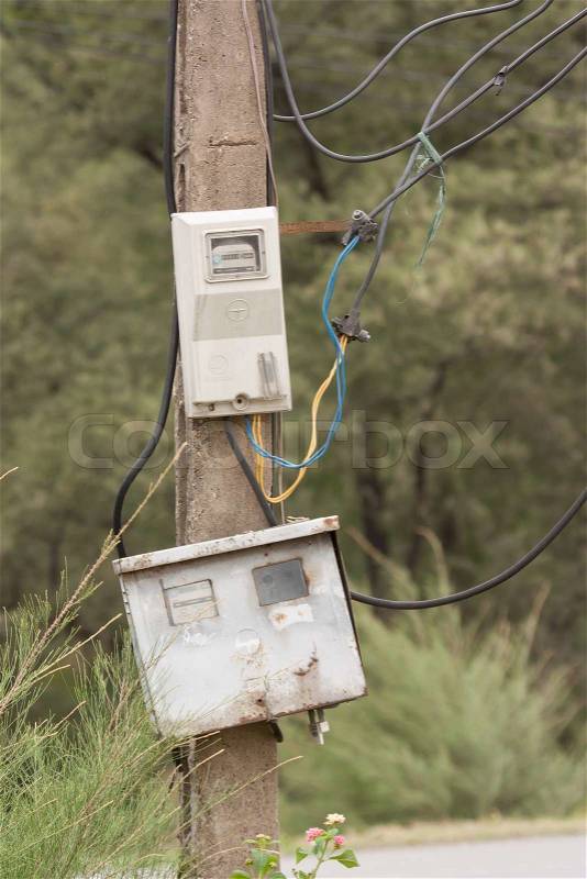 Cabinet with electrical meter on a concrete pole, stock photo