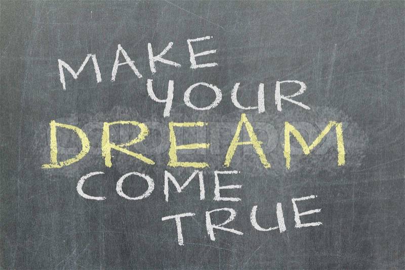 Make your dream come true - motivational slogan handwritten, stock photo