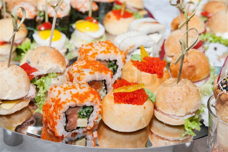 Canape with meat seafood egg and cheese, stock photo