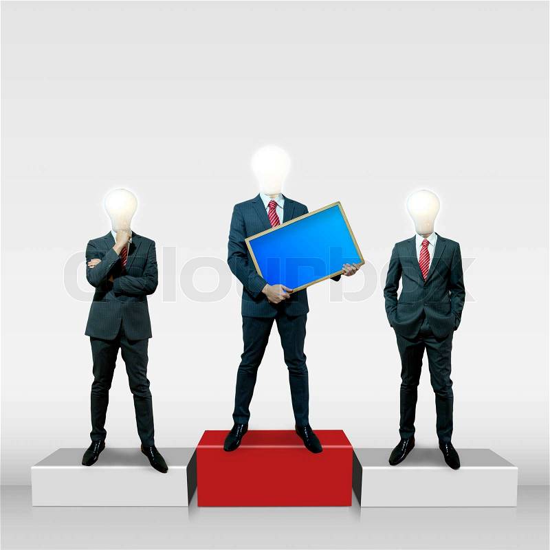 Business man with bulb head holding black board on the screen background, stock photo