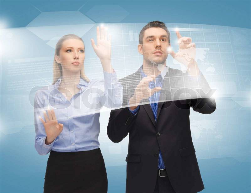 Man and woman working with virtual touch screens, stock photo