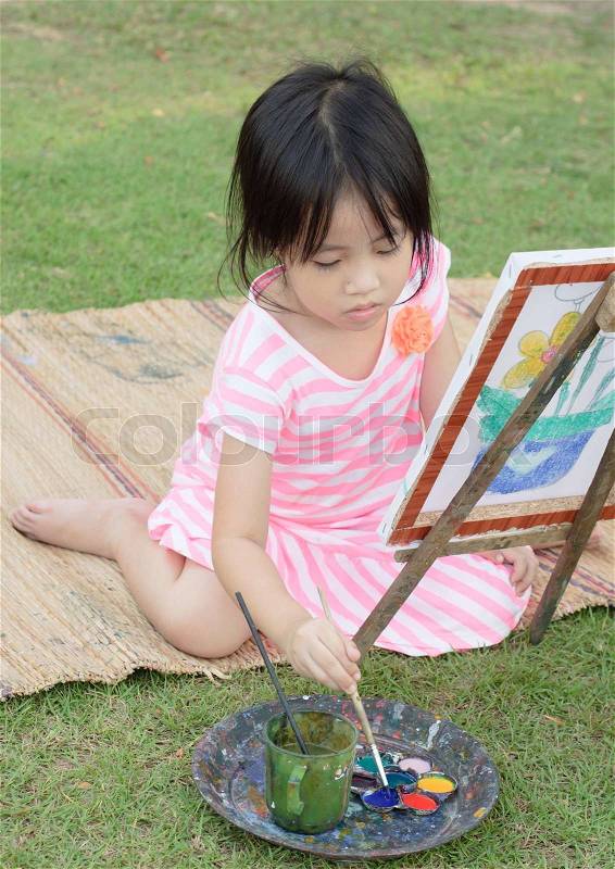 Asian young girl painting, stock photo