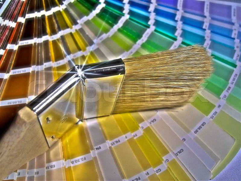 A color guide and paintbrush, stock photo