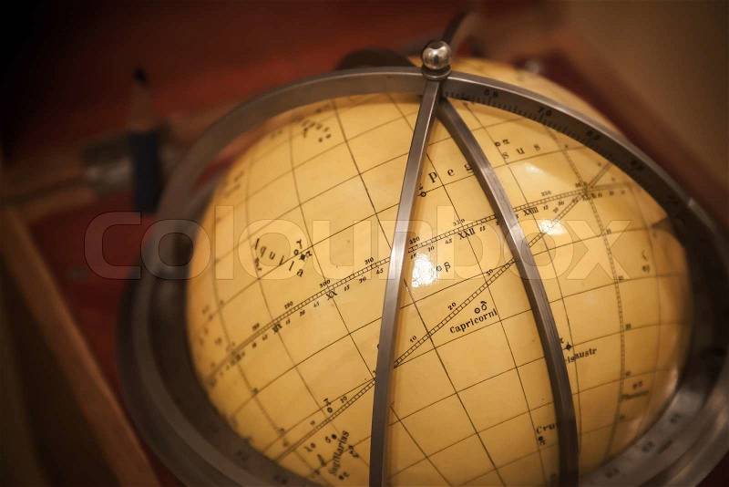 Ancient travel star sky globe in wooden box, stock photo