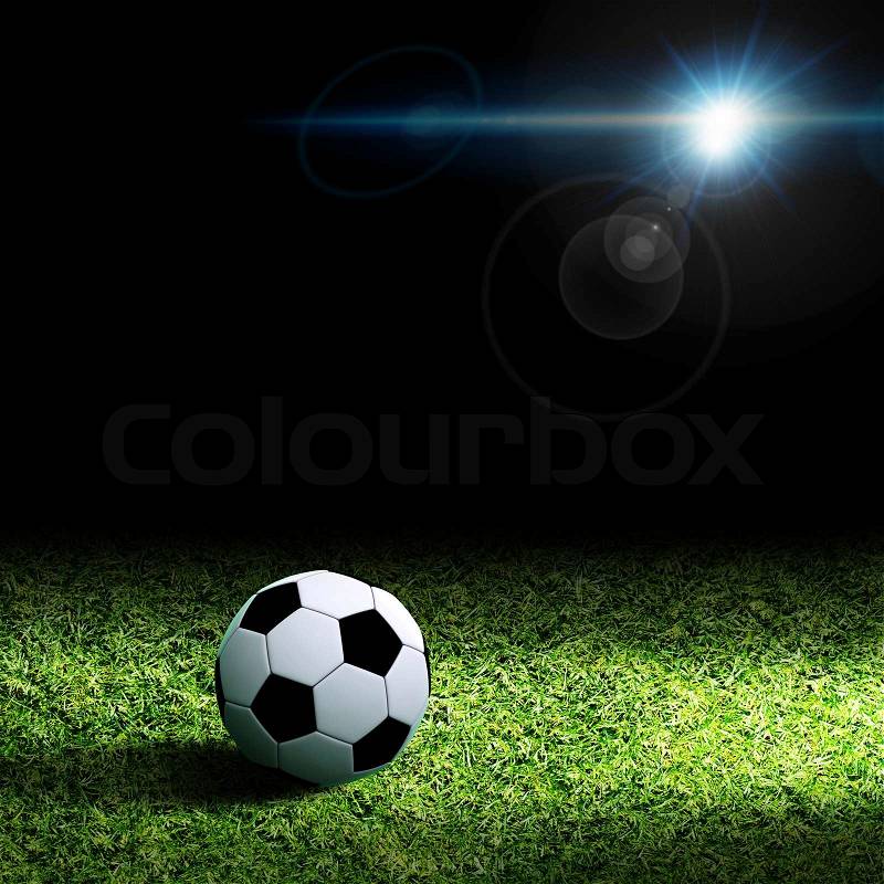 Soccer ball on grass, stock photo