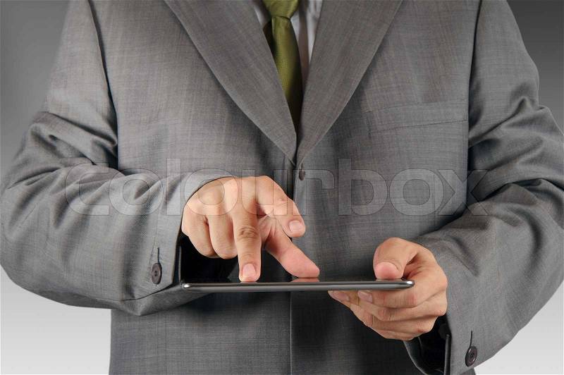 Business man hand working on a digital tablet, stock photo