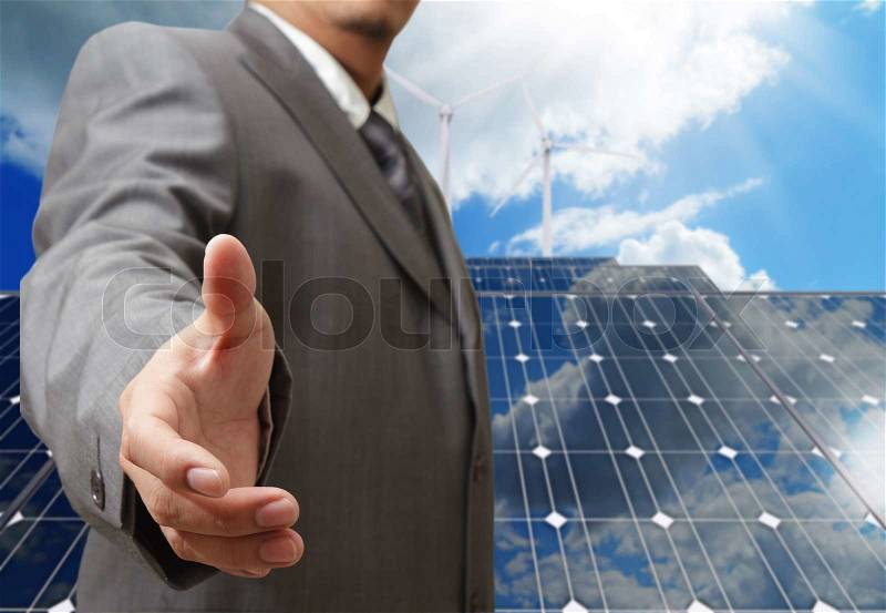 Business man offers handshake with green business concept, stock photo