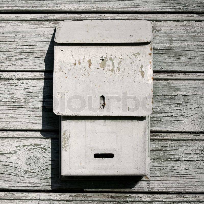 Traditional old mail box on the wooden wall, stock photo
