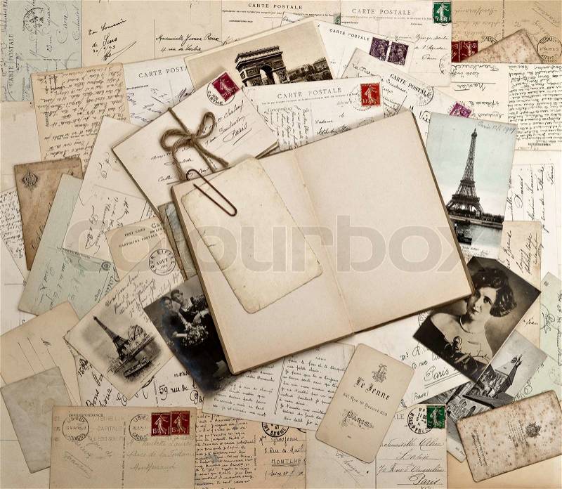 Old letters, french post cards and open diary book, stock photo