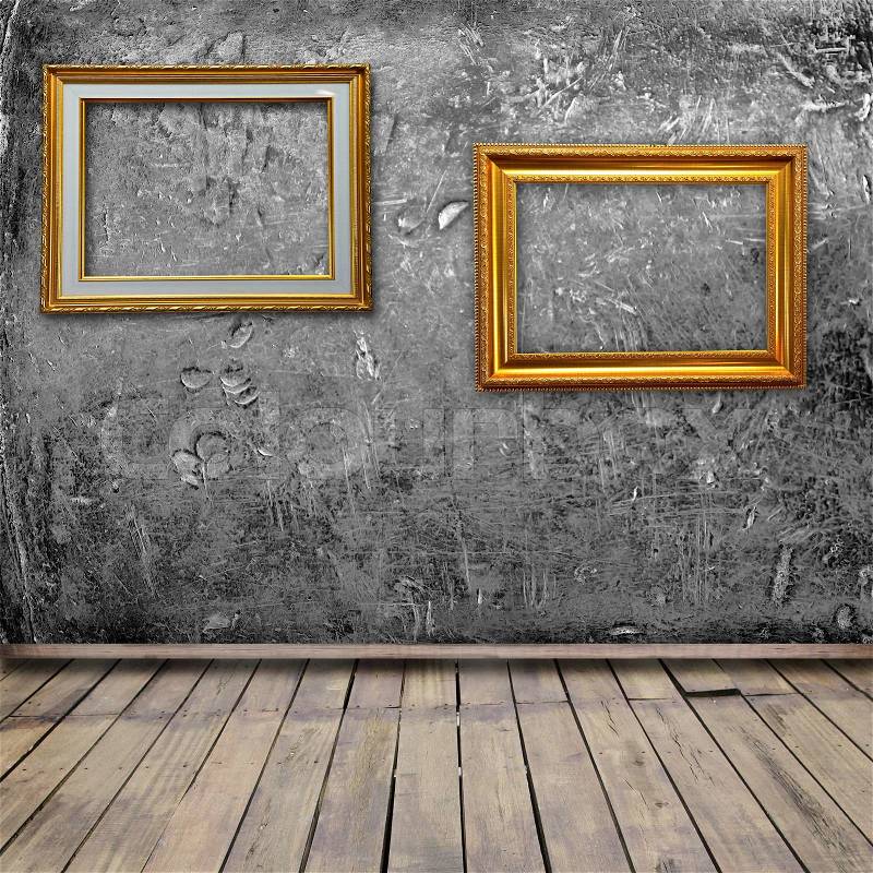 Old grunge room interior with vintage photo frames, stock photo