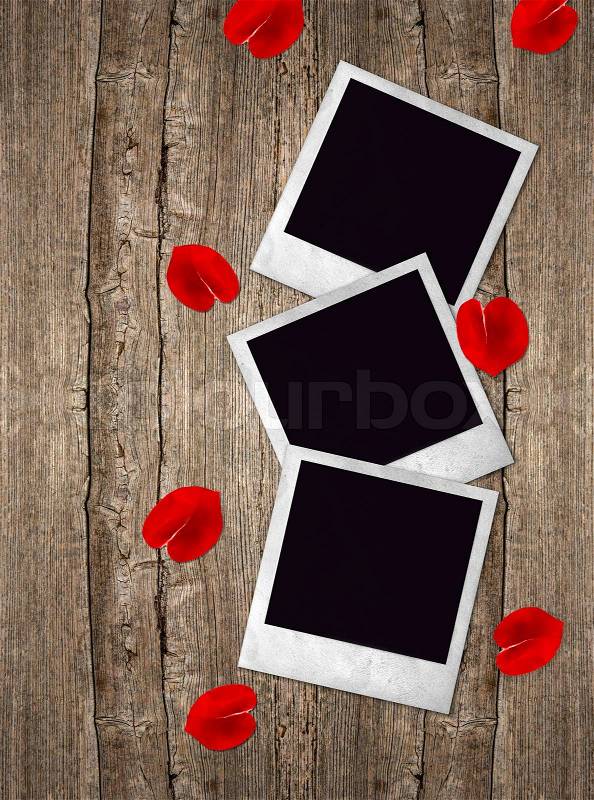 Three old photo frames with red roses petals, stock photo
