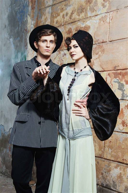 Retro styled fashion portrait of a young couple Clothing and make-up in 1920s style, stock photo