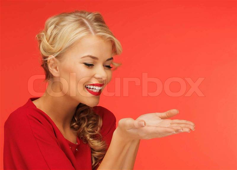 Woman showing something on the palms, stock photo