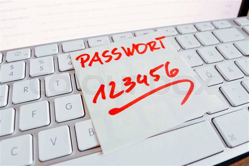 Note on computer keyboard: password 123456, stock photo