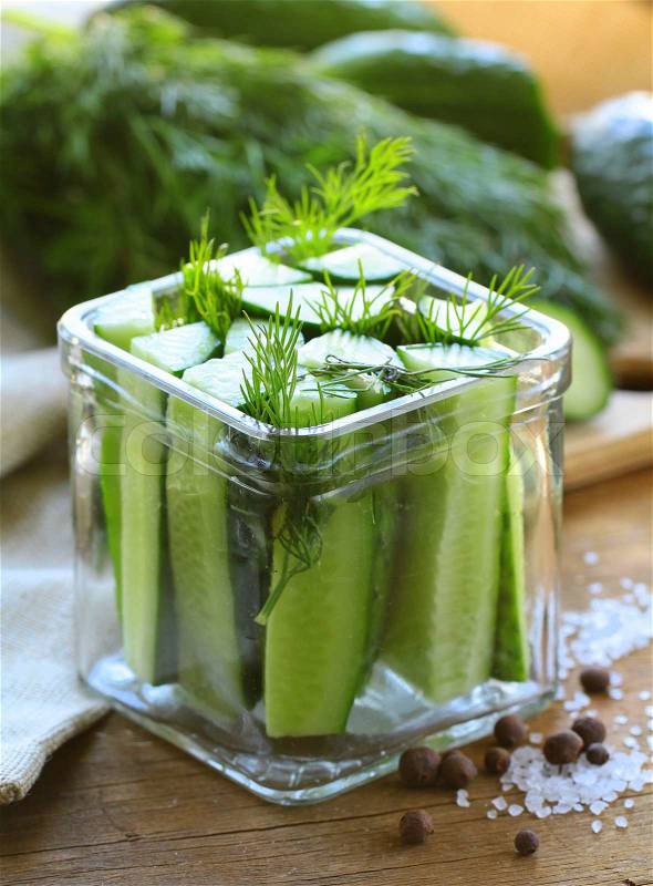 Cucumbers in the jar with dill salt, stock photo