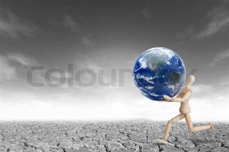 Wooden model running with planet on the hand for eco and environmental concept, stock photo