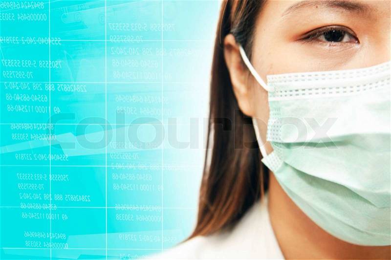 Half face closeup portrait of a woman doctor wearing a mask, stock photo