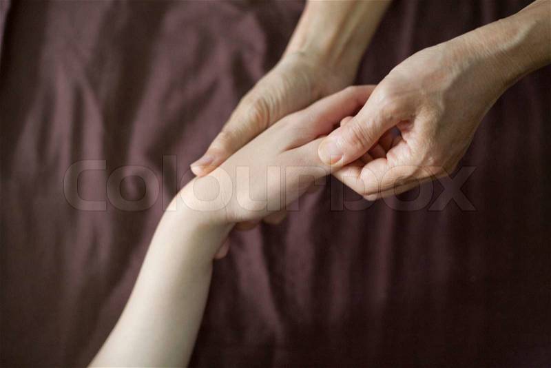 Hand Thai massage in the day spa, stock photo