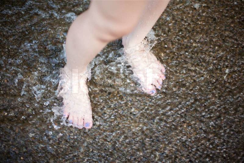 Foot in water, stock photo