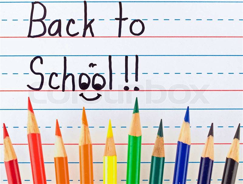 Back to School Written on a Lined Dry Erase Board with Colored Pencils, stock photo