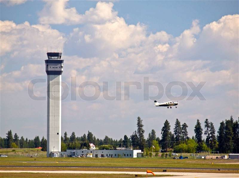 Air Traffic Control Tower of a Modern Airport with Aircraft Taking Off, stock photo