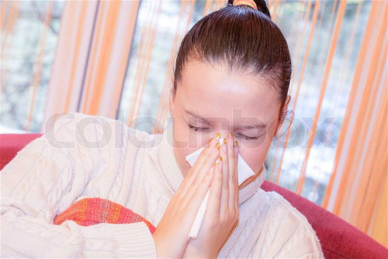 Flu.Woman Caught Cold. Sneezing into Tissue. Headache. Virus, stock photo
