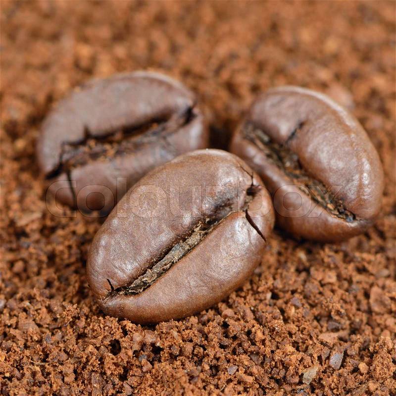 Coffee Beans on Ground Coffee Close-Up, stock photo