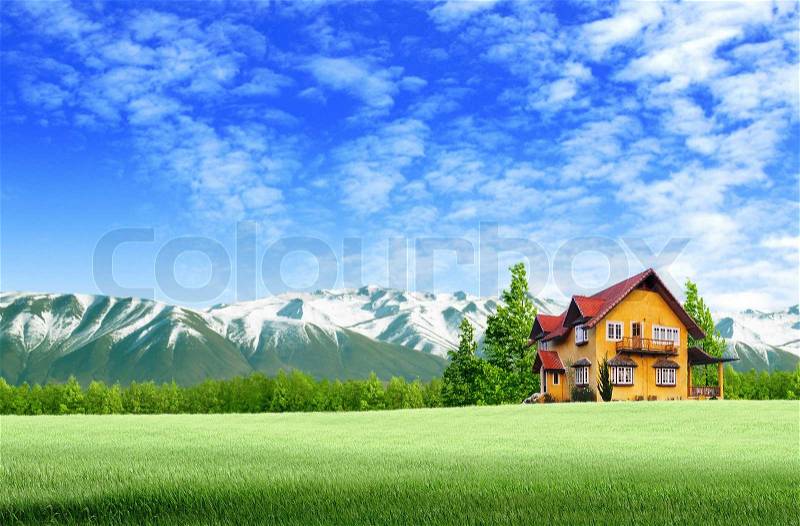 House and moutain on green field landscape with blue sky, stock photo