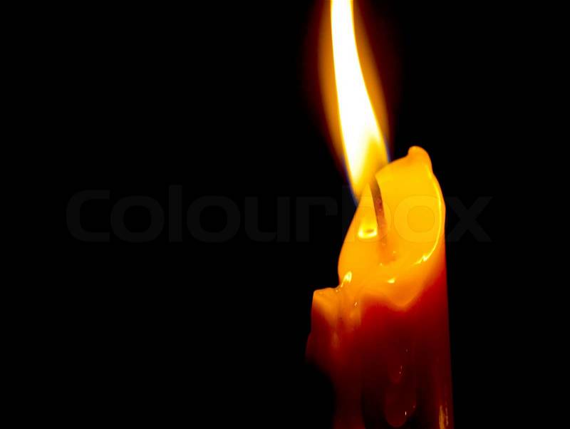 Candle in dark background, stock photo