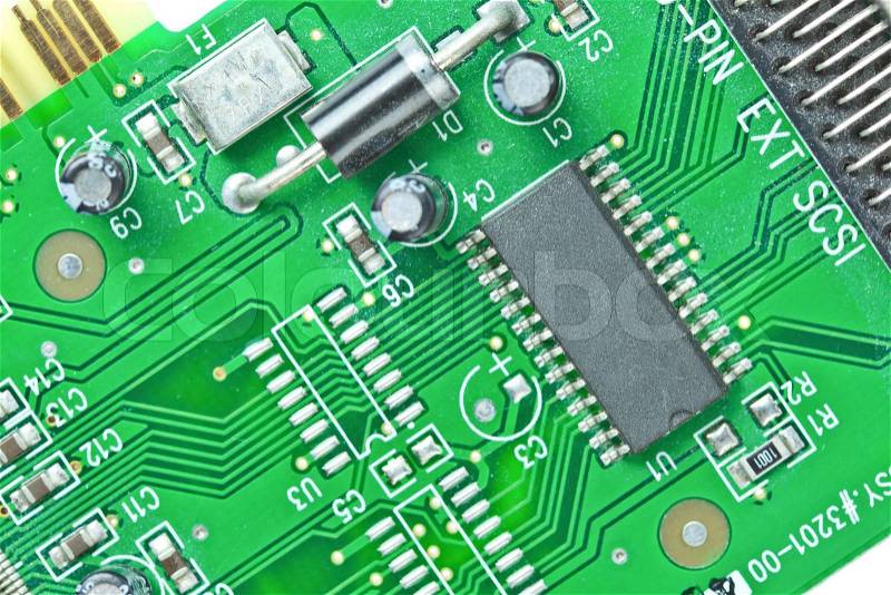 The modern printed-circuit board with electronic components macro background, stock photo