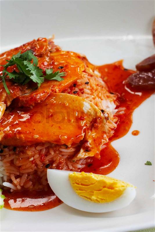 Rice with chicken in red sauce, stock photo