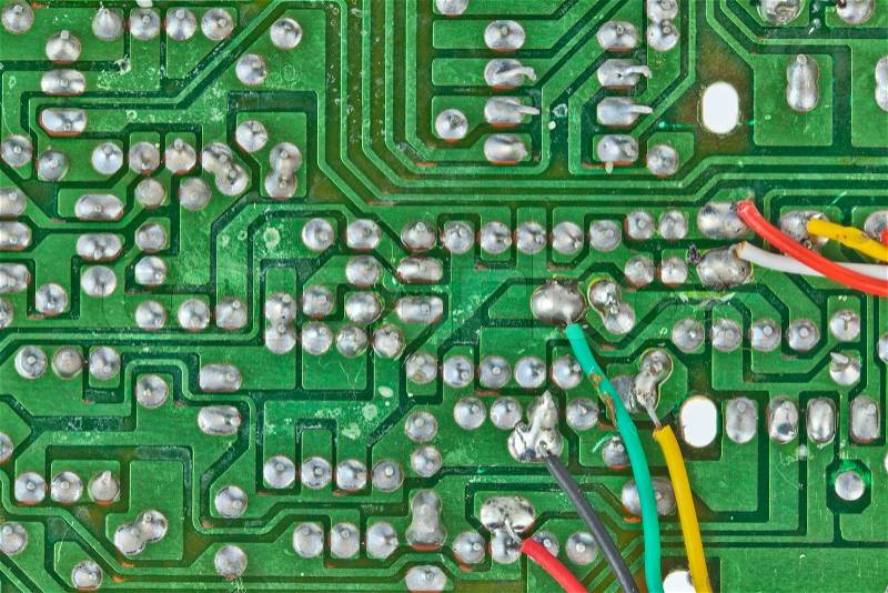 The printed-circuit board with electronic components macro background, stock photo