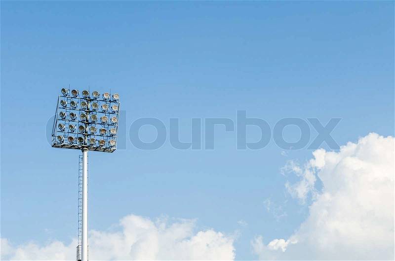 Big sport light in Soccer Stadium with Blue Sky, stock photo