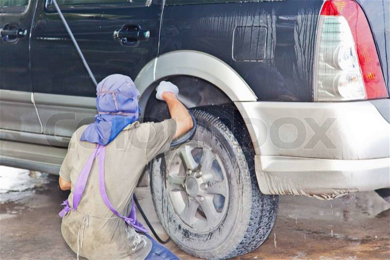 Car care work with machine cleaning at service station, stock photo
