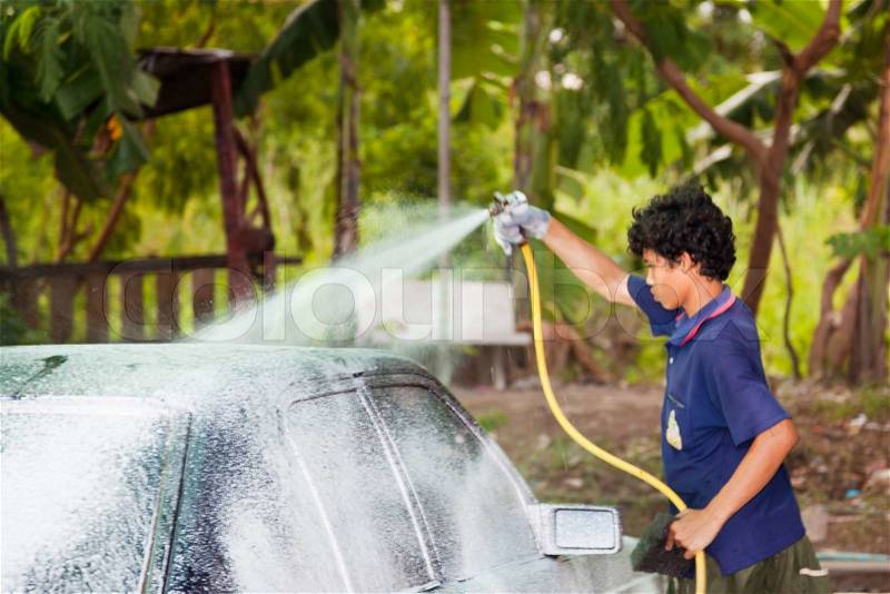 Car care work with machine cleaning at service station, stock photo