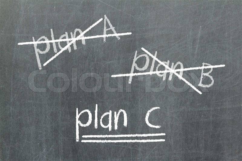 Crossing out Plan A and Plan B and writing Plan C, stock photo