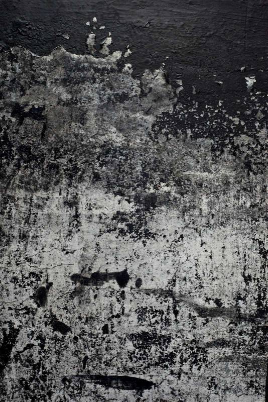 Old black paint texture peeling off concrete wall background, stock photo