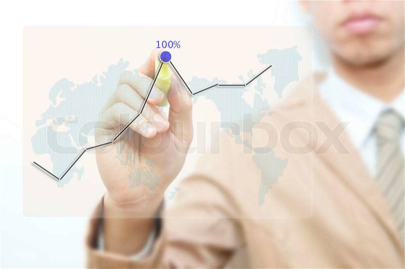 Young business man drawing graph on the transparent screen, stock photo