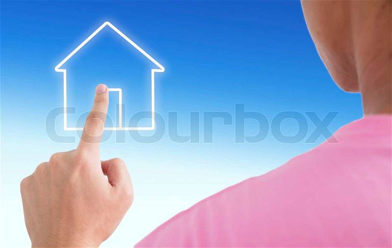Man point finger on the screen with blue sky as a symbol of the real estate business, stock photo