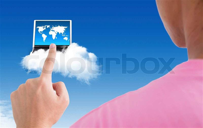 Man point finger on the screen with computer on blue sky, stock photo