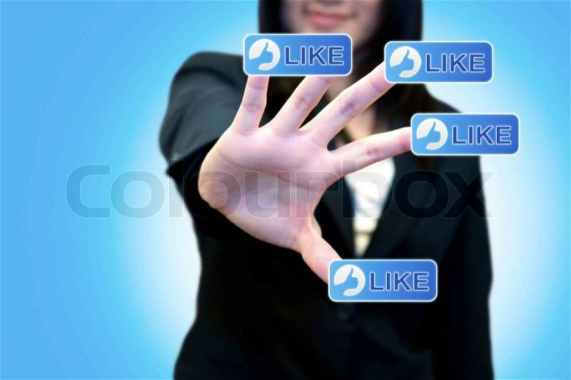 Business woman with hand touching LIKE button on touch screen, stock photo