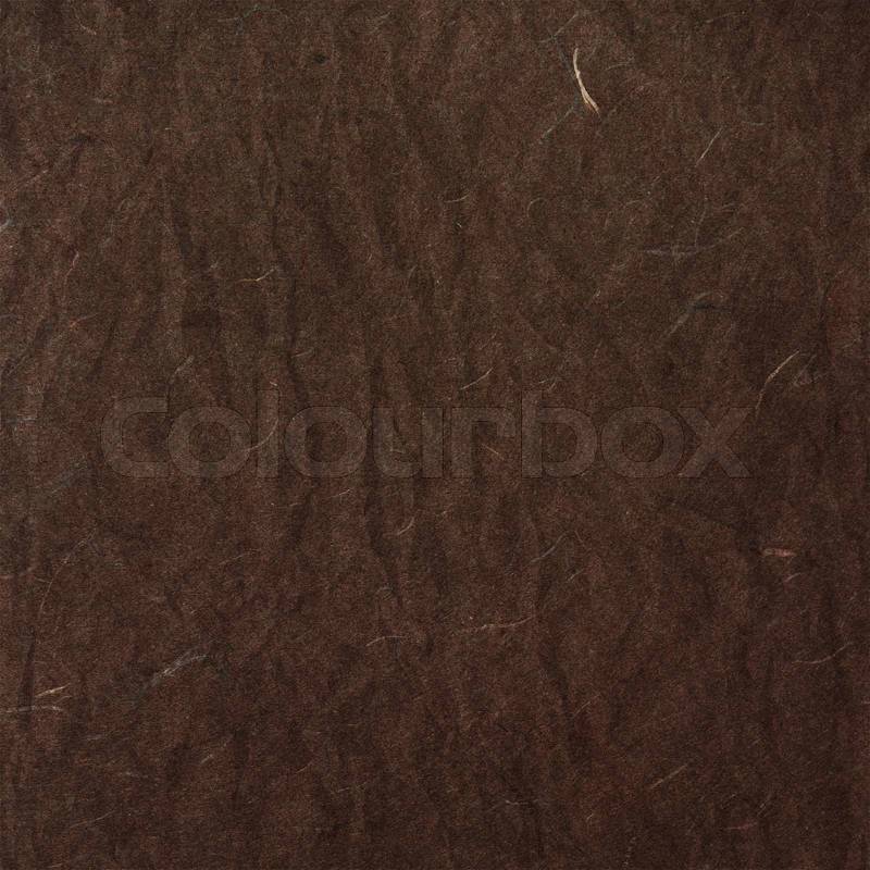Old brown crumpled rice paper texture, stock photo