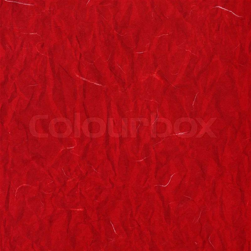 Old red crumpled rice paper texture, stock photo