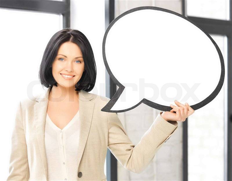 Smiling businesswoman with blank text bubble, stock photo