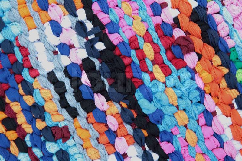 Striped pattern vivid colors of hand made doormat from recycle fabric, stock photo